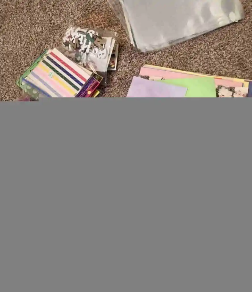 craft supplies being sorted on the floor of a craft room.