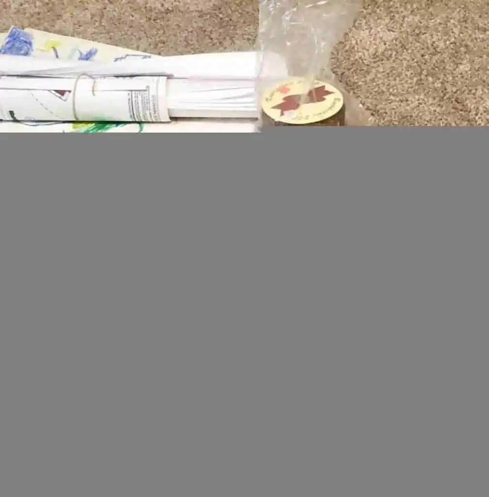 stack of ribbons on a carpeted floor.