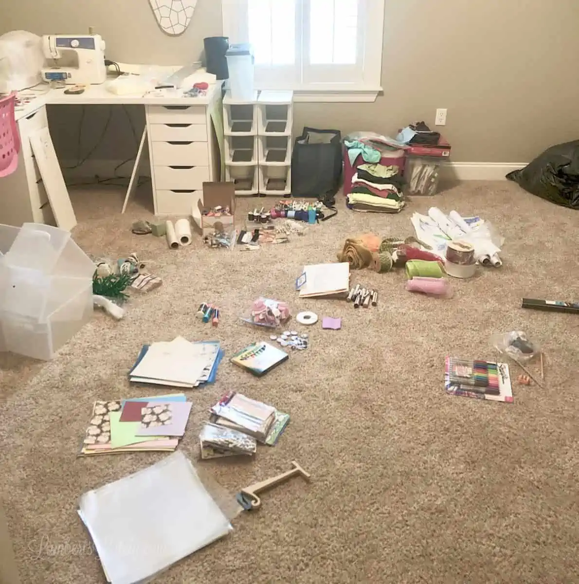 craft supplies scattered on carpeted floor.