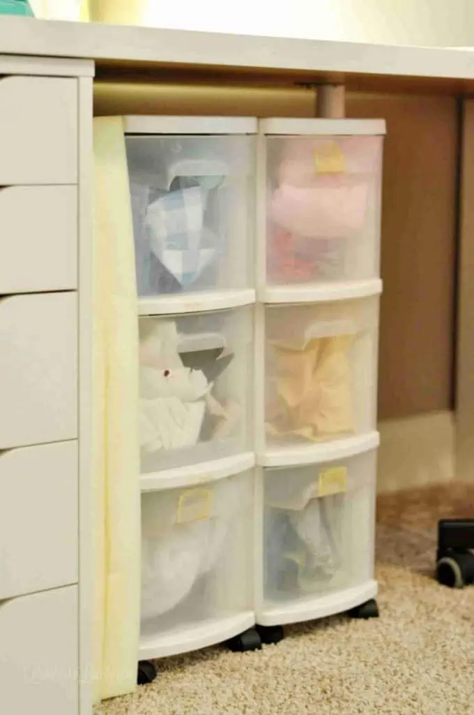 plastic stacking organizers full of fabric.