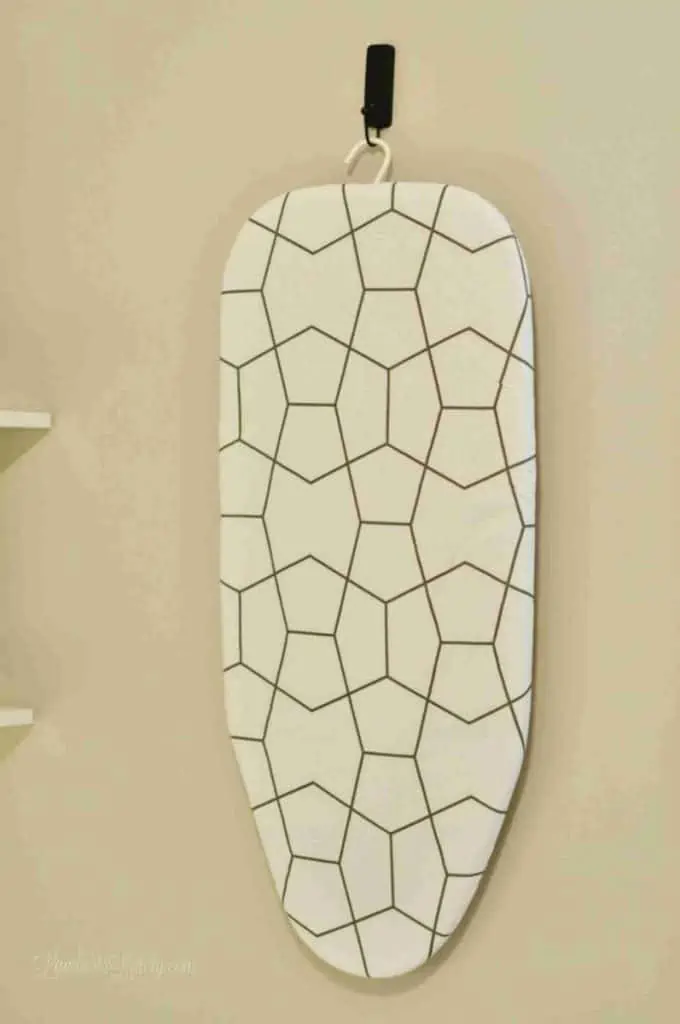 ironing board hanging on a wall.