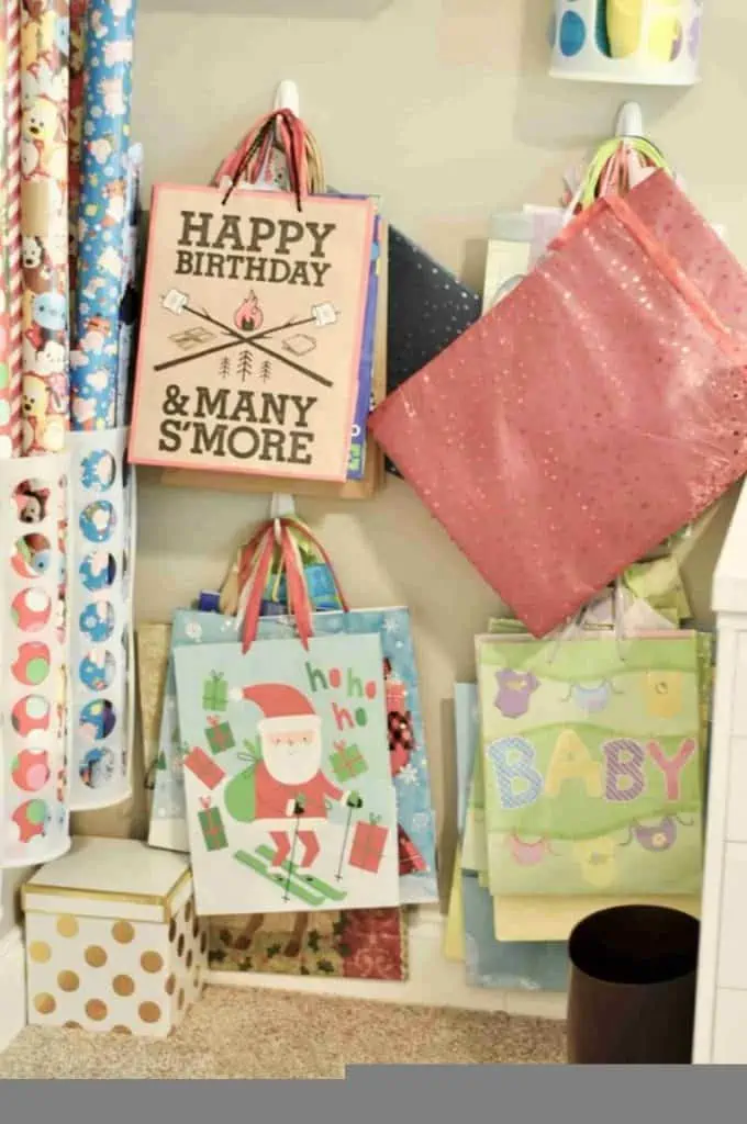 gift bags hanging on a wall.