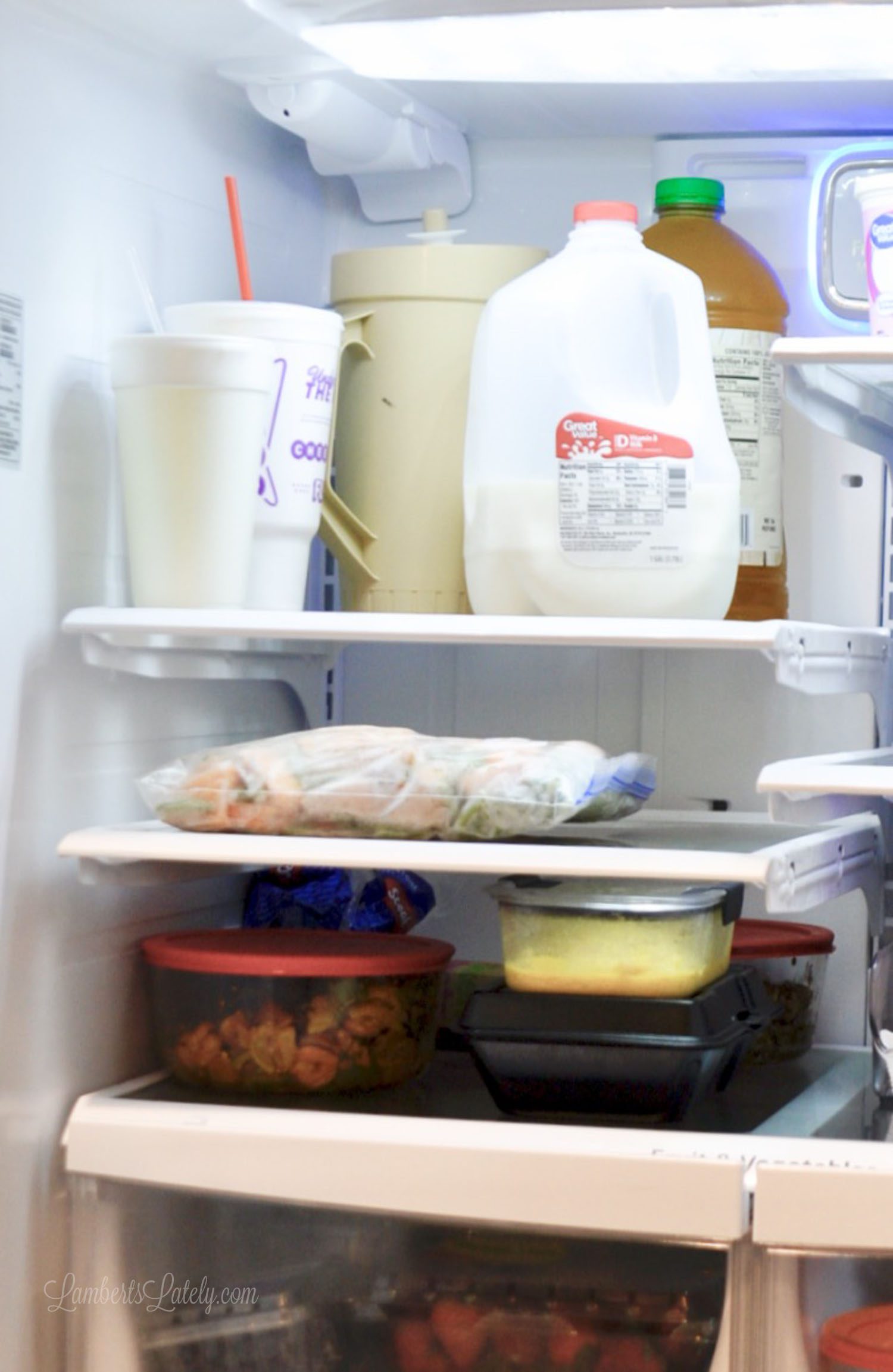 refrigerator shelf holding drinks