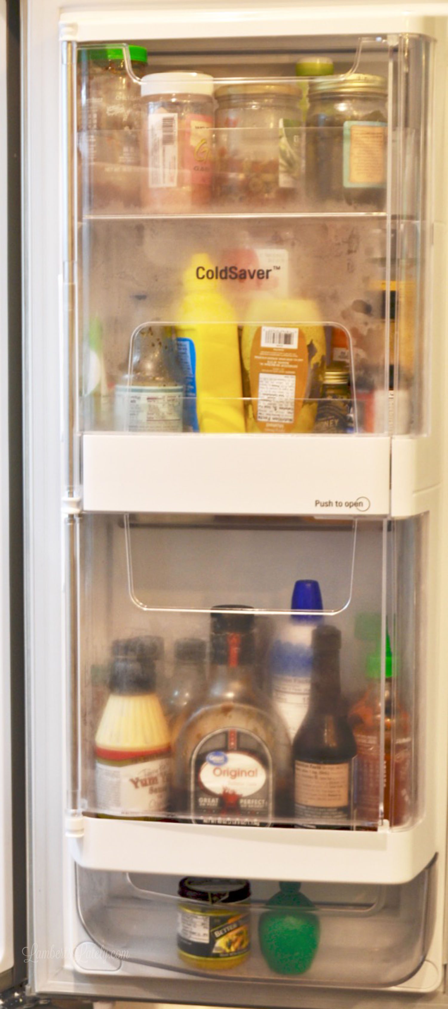 refrigerator door filled with condiments