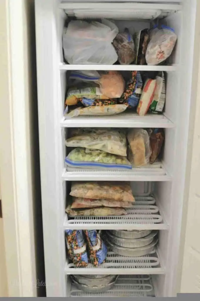 deep freezer, open, filled with freezer meals