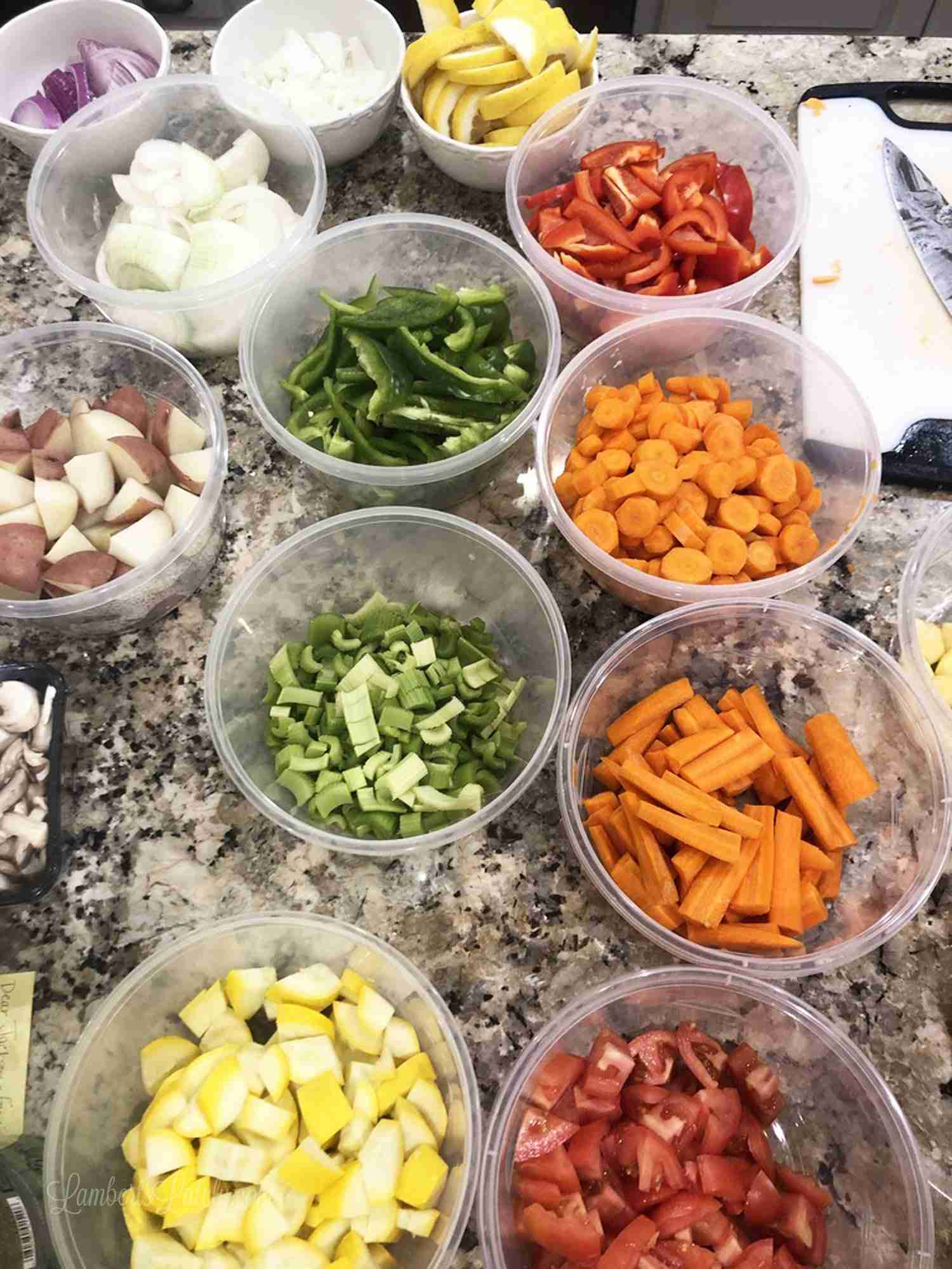 colorful vegetables in containers on a kitchen counter.