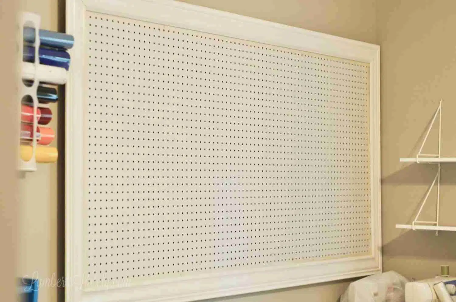 empty pegboard with crown molding installed
