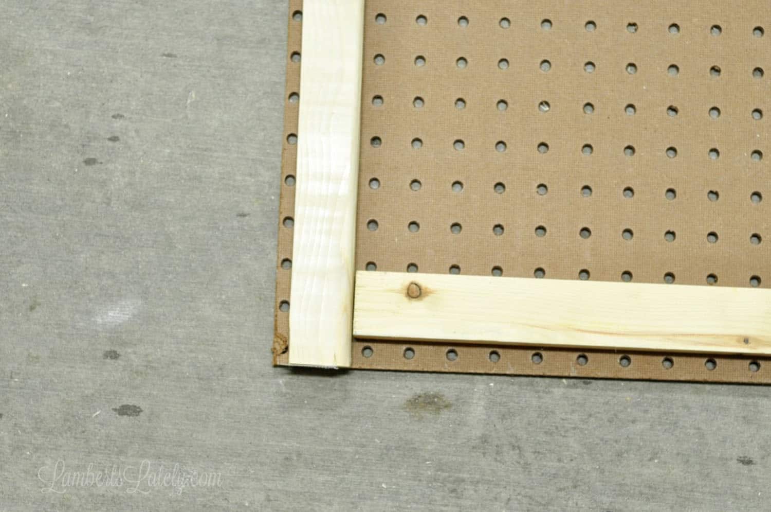 1 x 2 furring strips on back of pegboard.