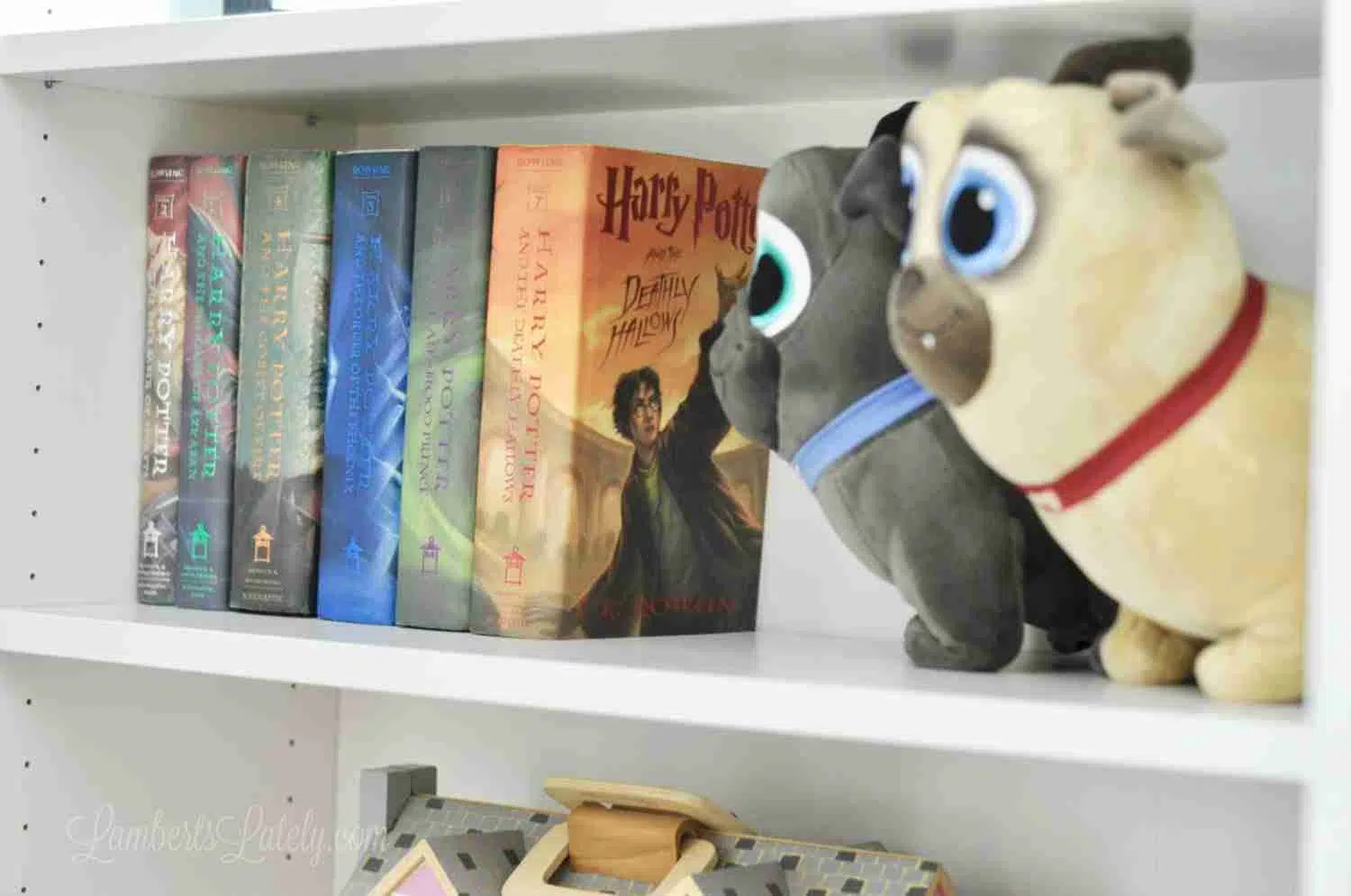 books and stuffed animals on a shelf