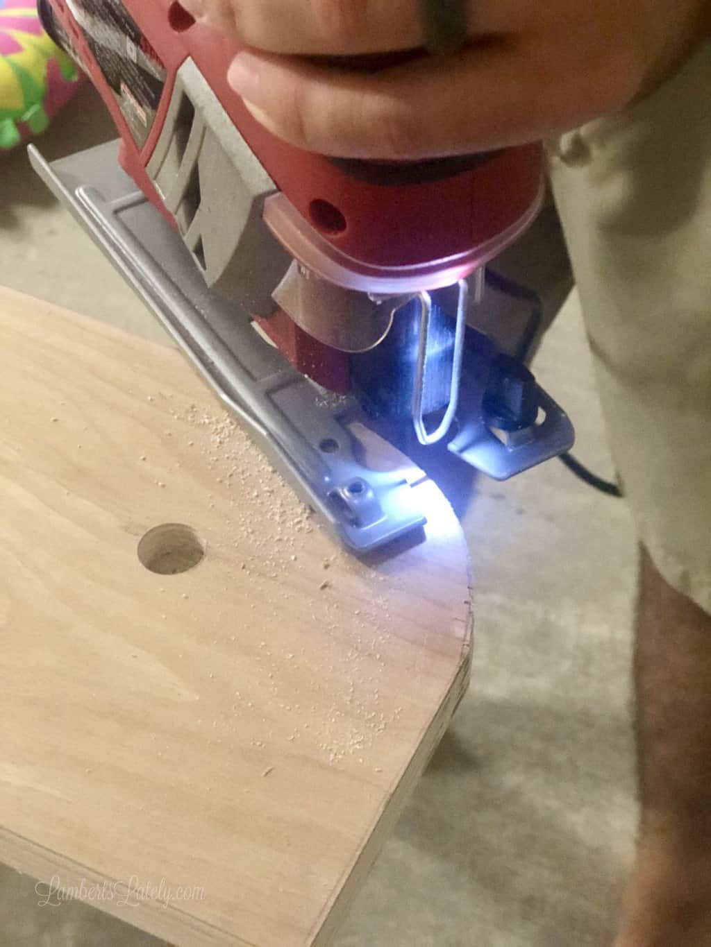 jig saw cutting round edge in wood.