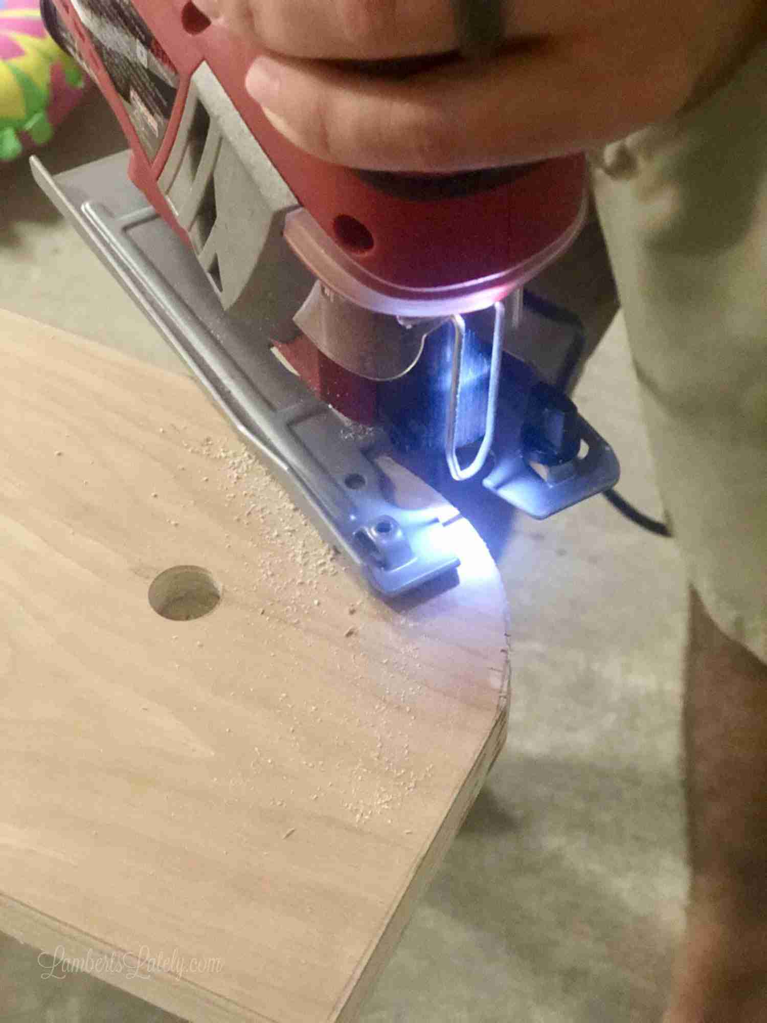 jig saw cutting round edge in wood.