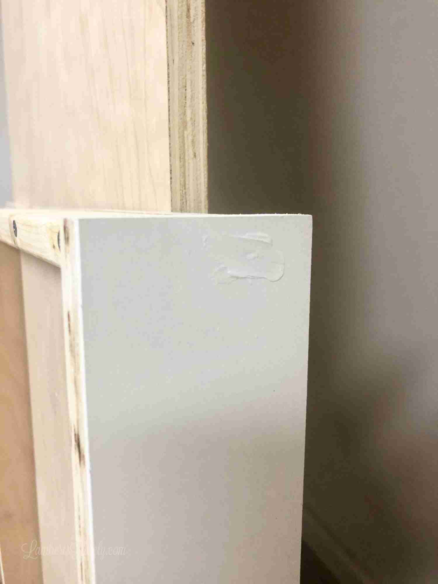 side view of white frame with filler over hole.