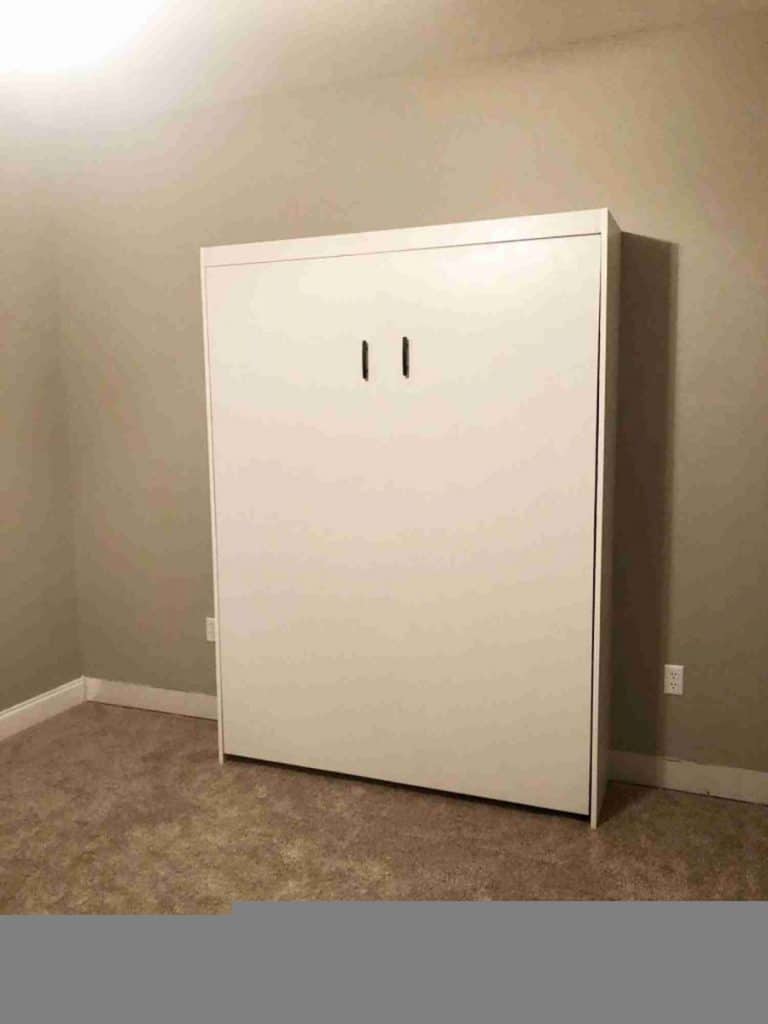 Create-a-bed installed on a bedroom wall.