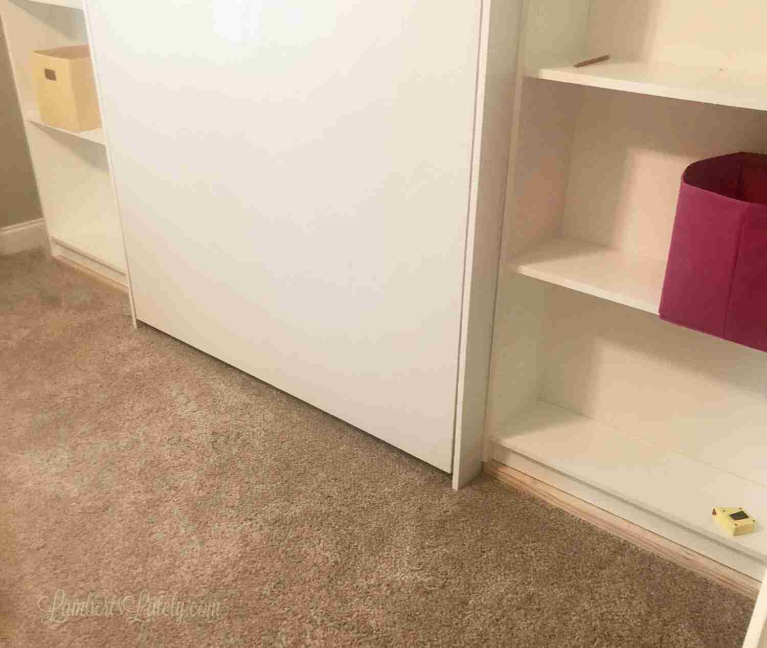 bottom of murphy bed and shelves before installing baseboards.