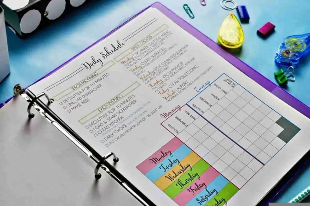 Daily cleaning schedule in a notebook on a desk