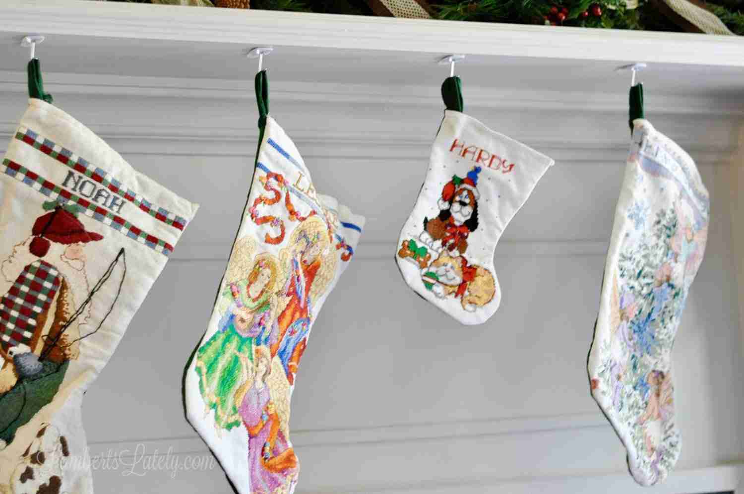 kids stocking stuffers - family stockings on a mantle