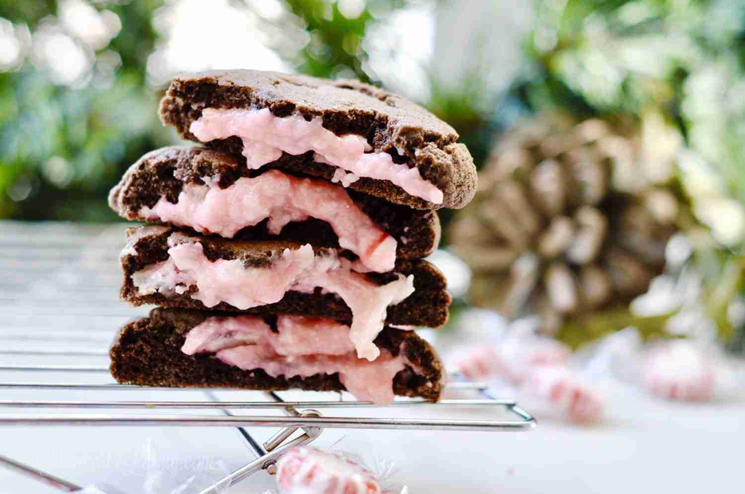 chocolate peppermint lava cookies stacked on a baking rack