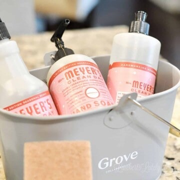 three mrs meyer's products in a grove caddy.