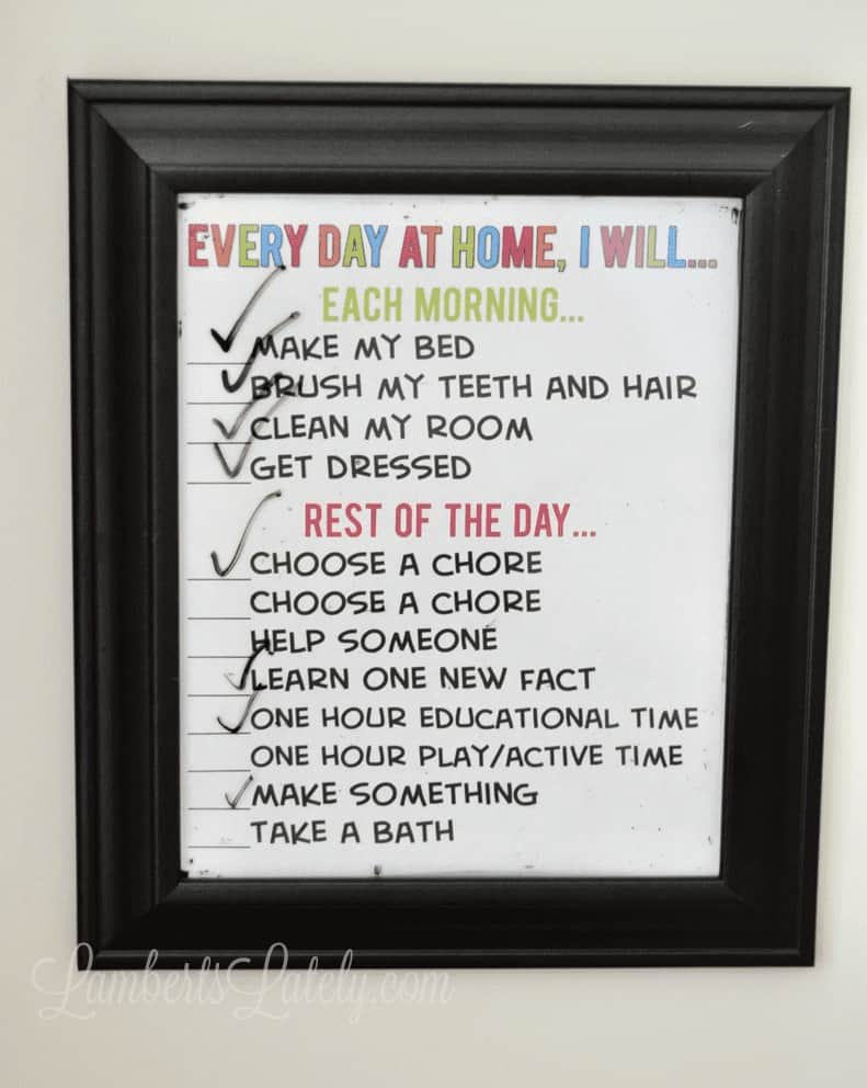 chore chart framed on a wall