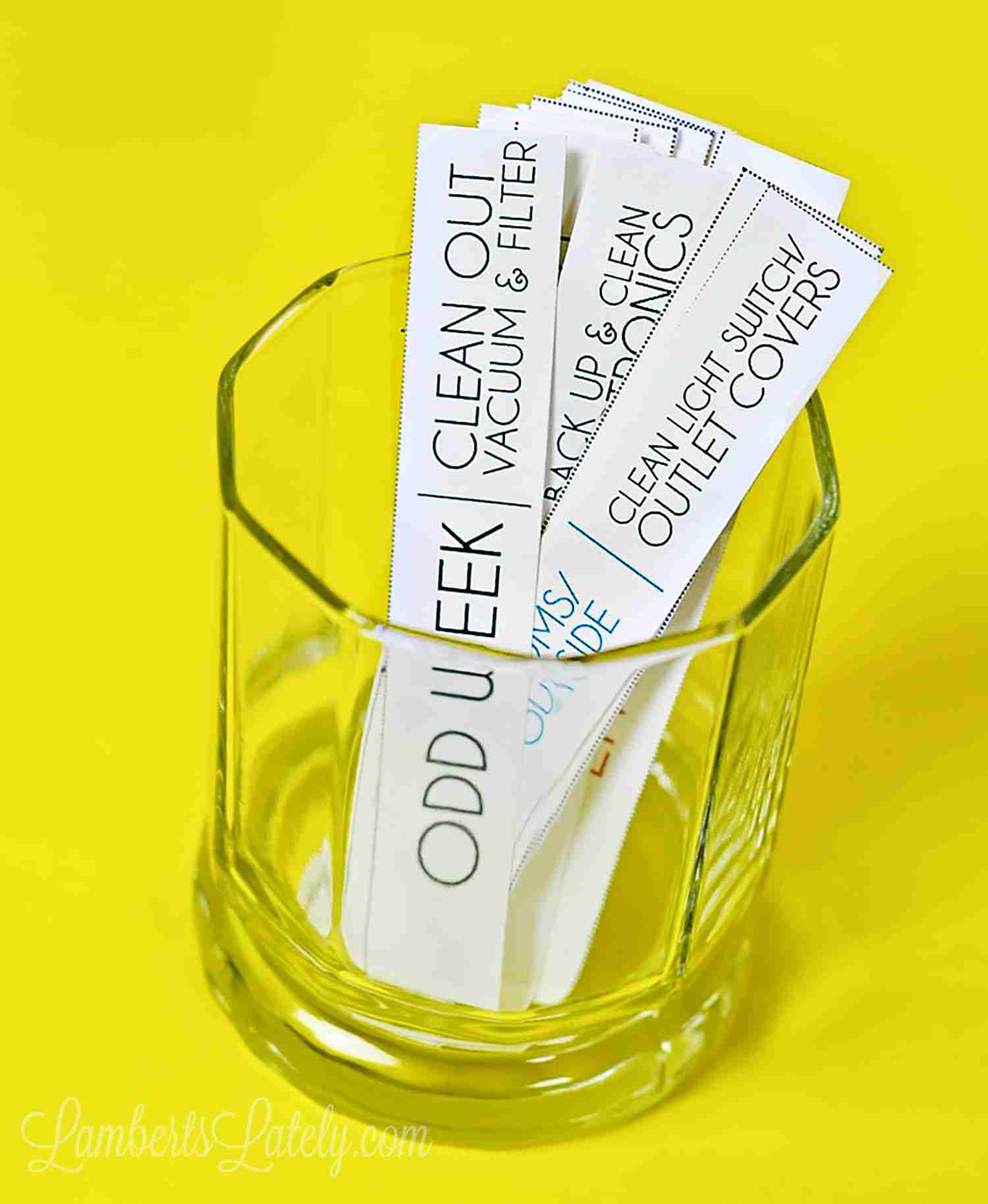 chore cards in a glass with yellow background