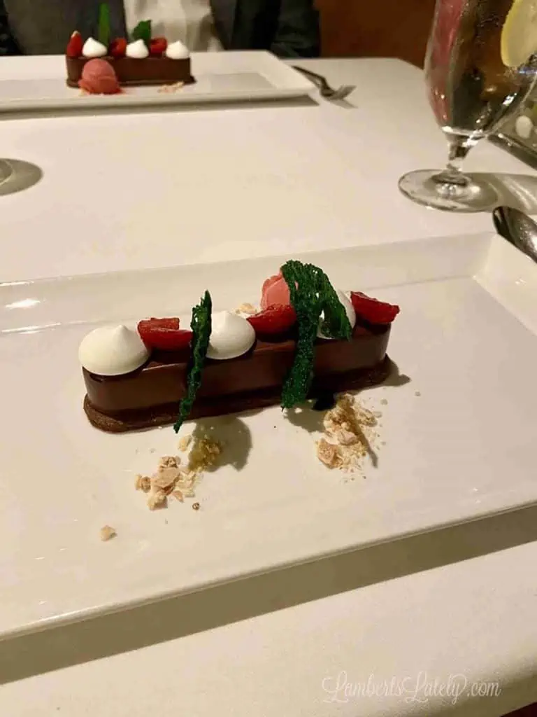 chocolate dessert on a white plate in Palo on a disney cruise.