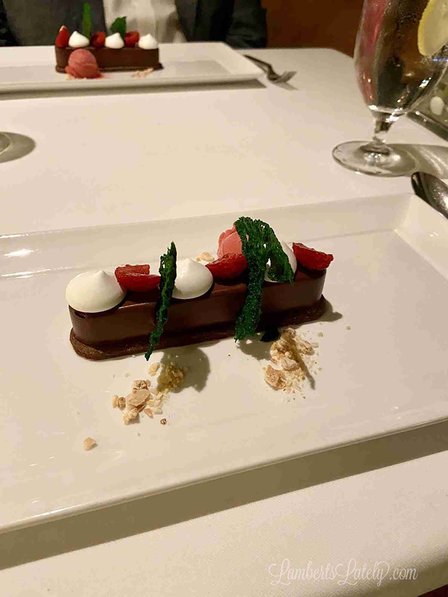 chocolate dessert on a white plate in Palo on a disney cruise.
