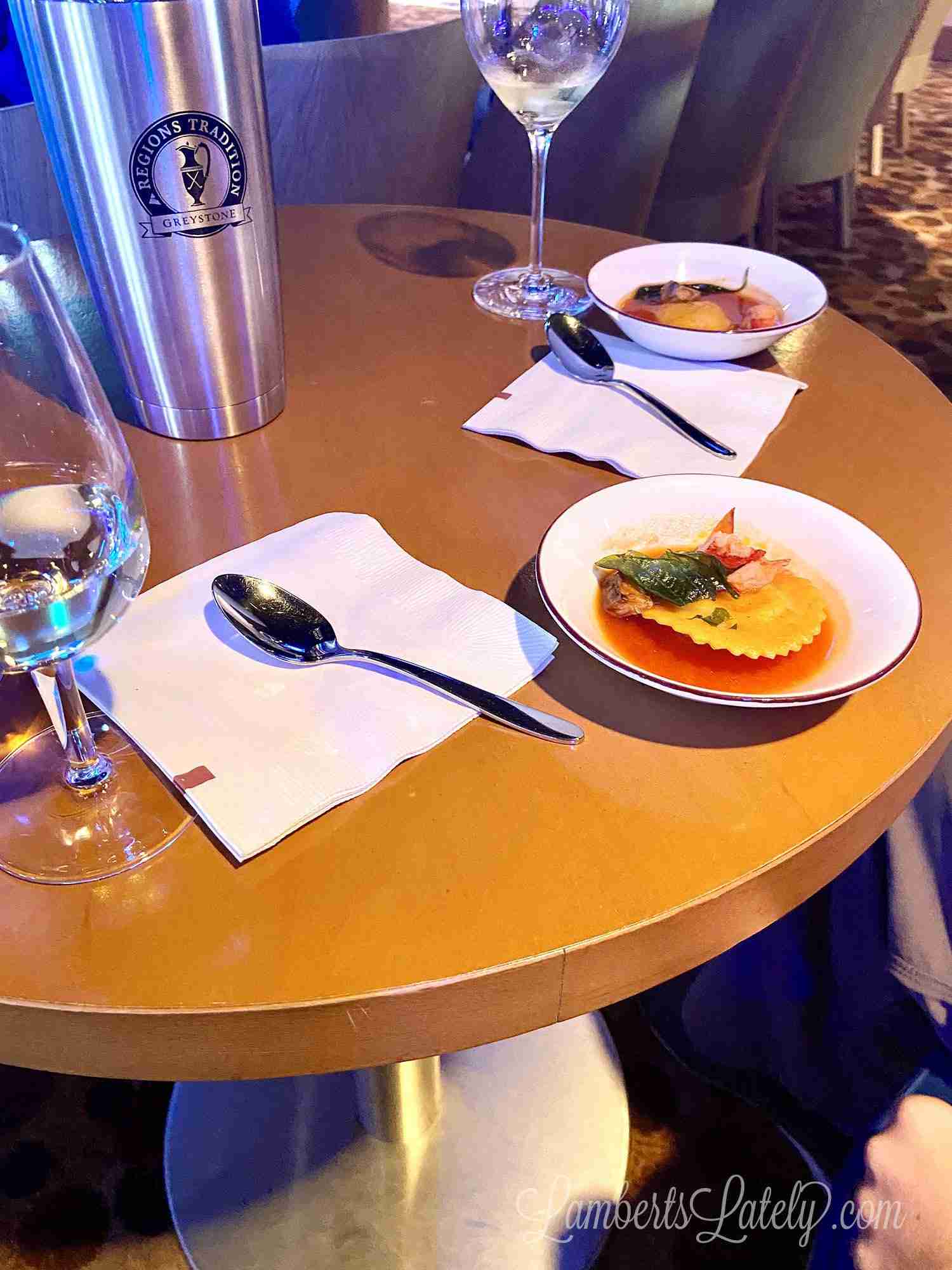 small plates and glasses of wine.