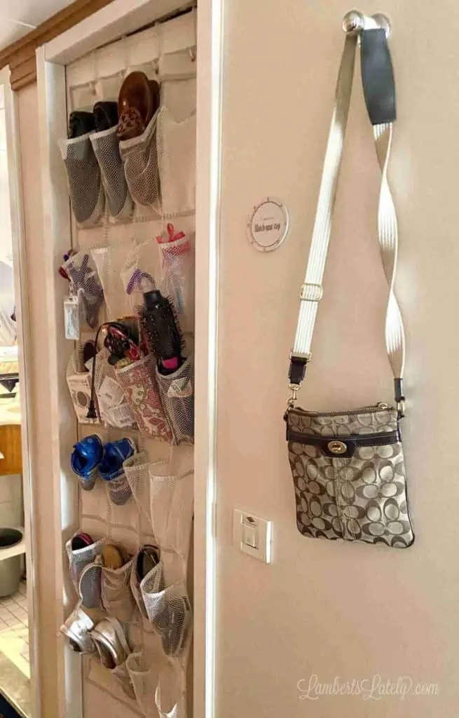 hanger holding a purse on a wall in a cabin.