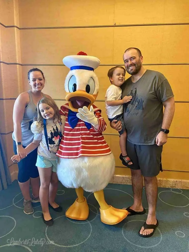 family with donald duck on a disney cruise.