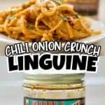 Close-up of chili onion crunch-laced linguine pasta with garnishes on a white plate.