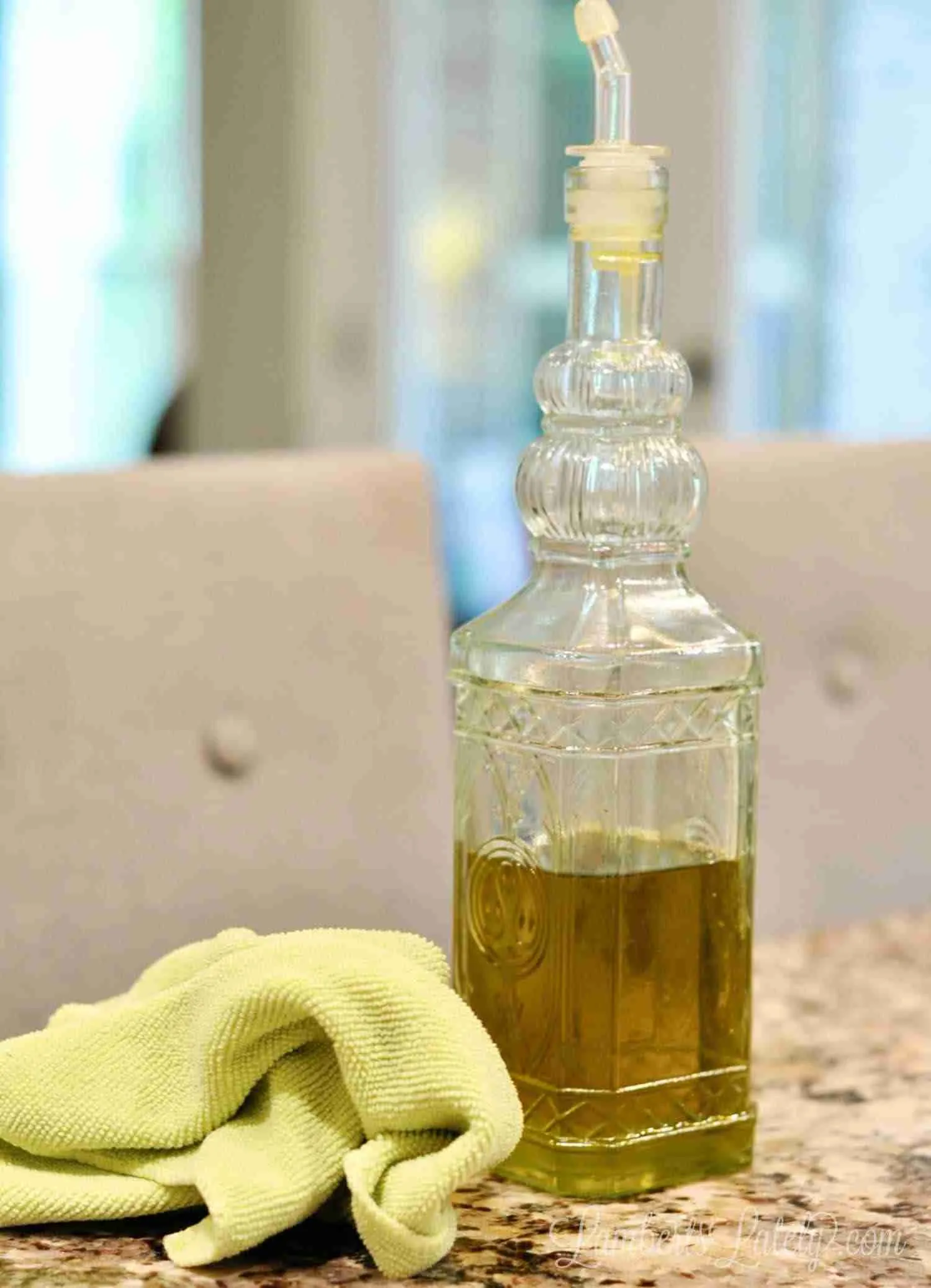 olive oil and microfiber cloth on a counter
