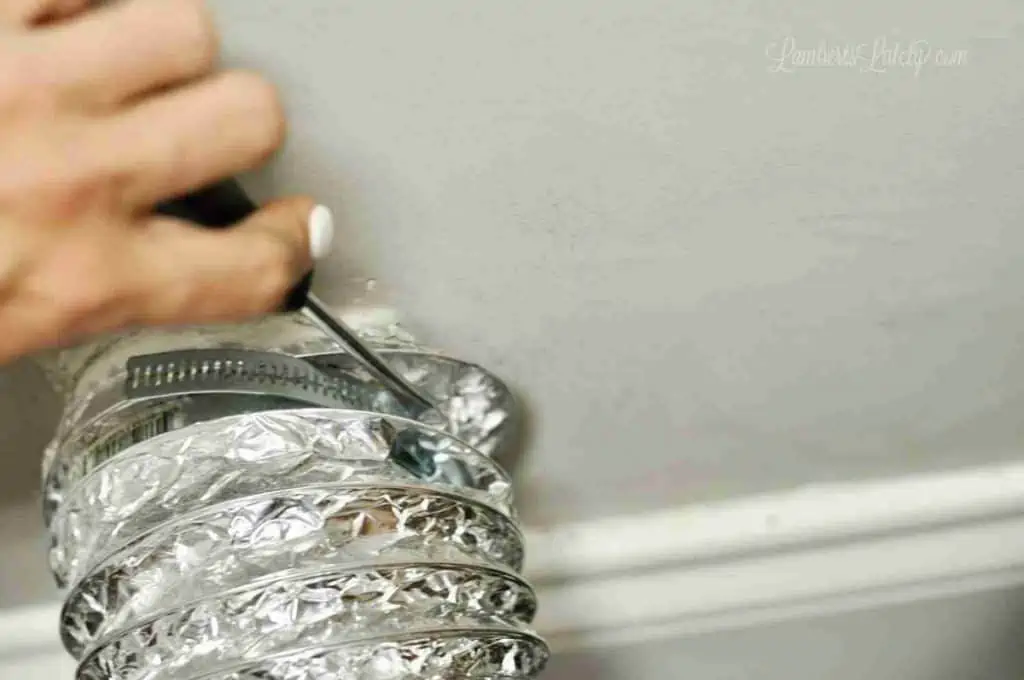 disconnecting a dryer vent hose from the wall