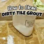 Cleaning supplies and a bag of baking soda on a tiled floor for grout cleaning.