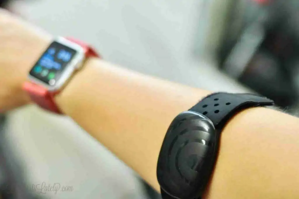 Apple watch and Schwinn heart band on an arm.