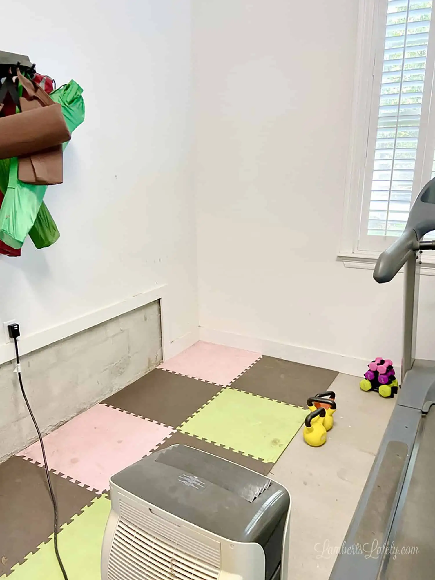 placing foam mat in a home gym.