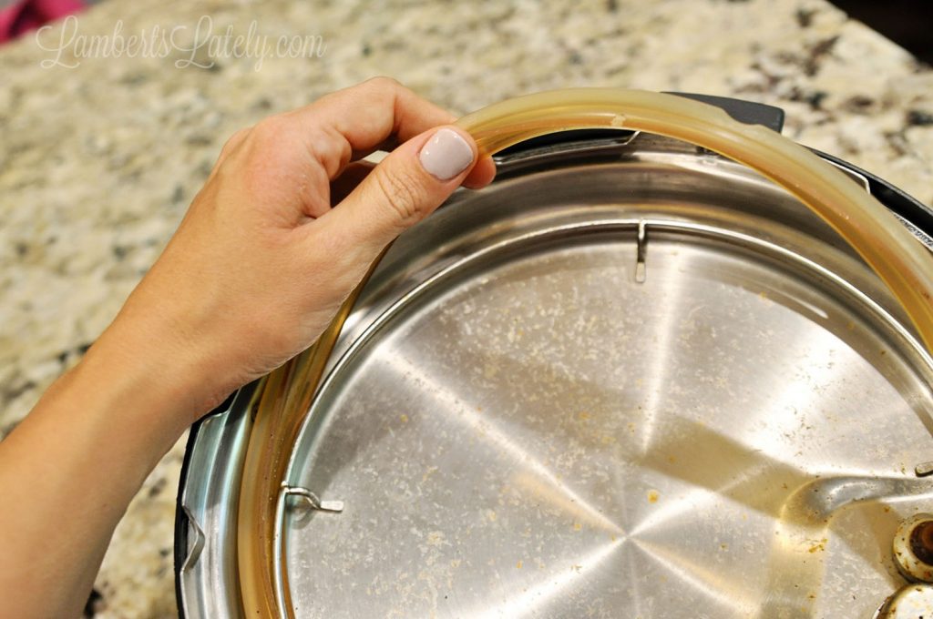 taking rubber sealing ring out of the lid of an instant pot.