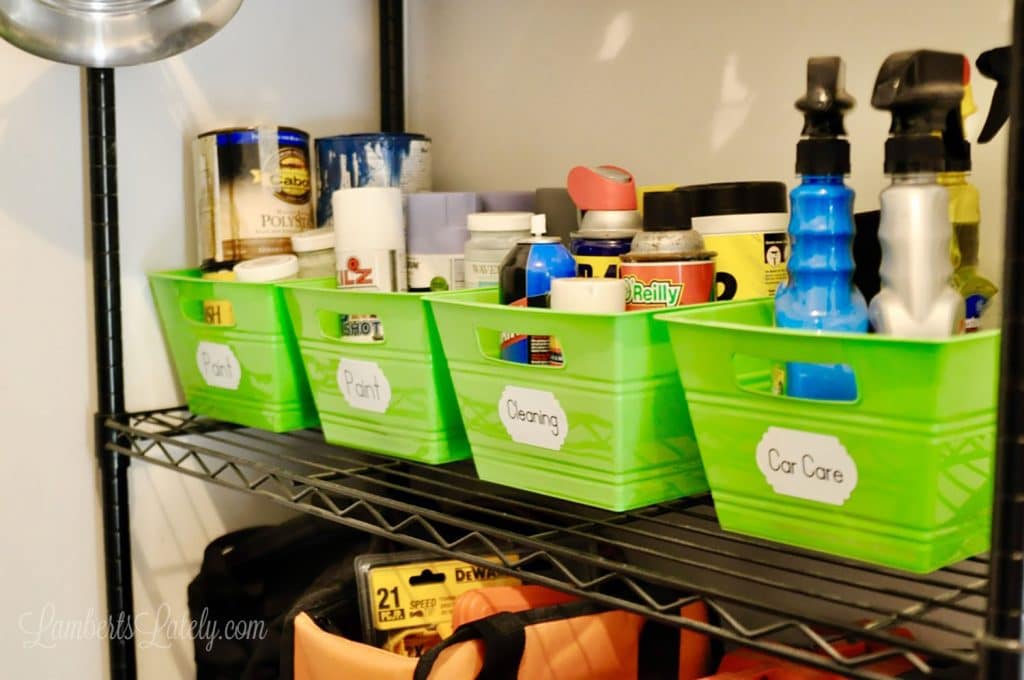set of containers holding garage supplies on a shelf