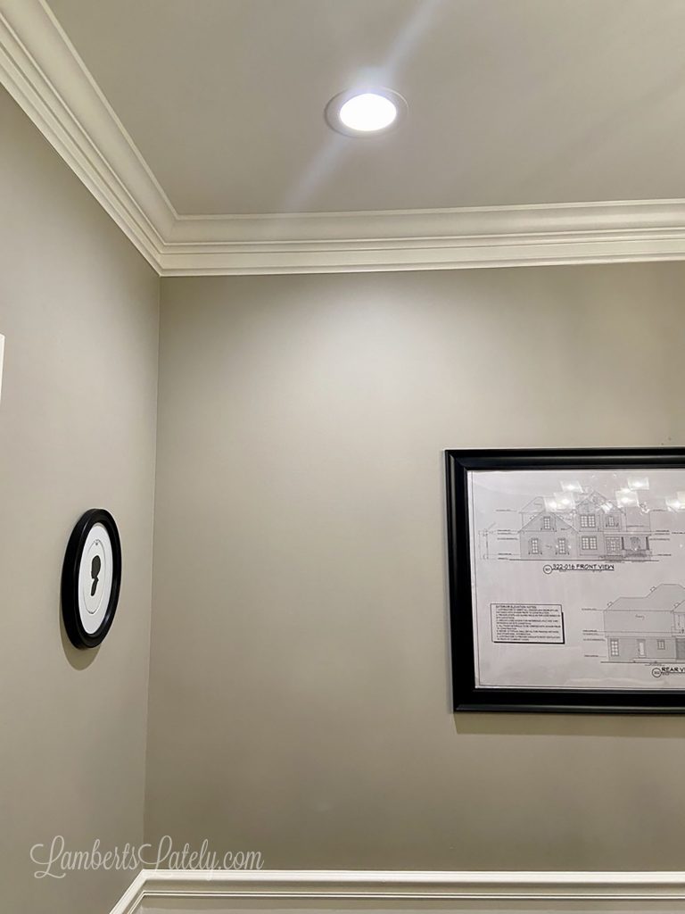 Check out this easy DIY for making existing crown molding look thick! Simply installing additional trim molding and using a faux painting trick makes simple molding look expensive.