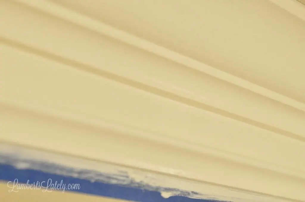 white painted thick faux crown molding.