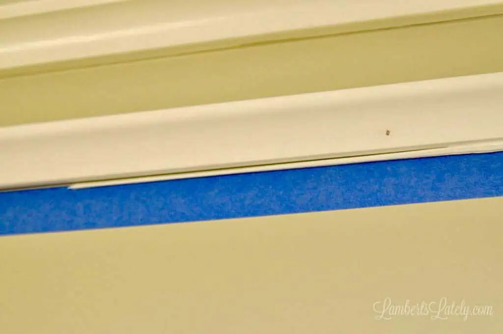 small bead of caulk below crown molding piece.