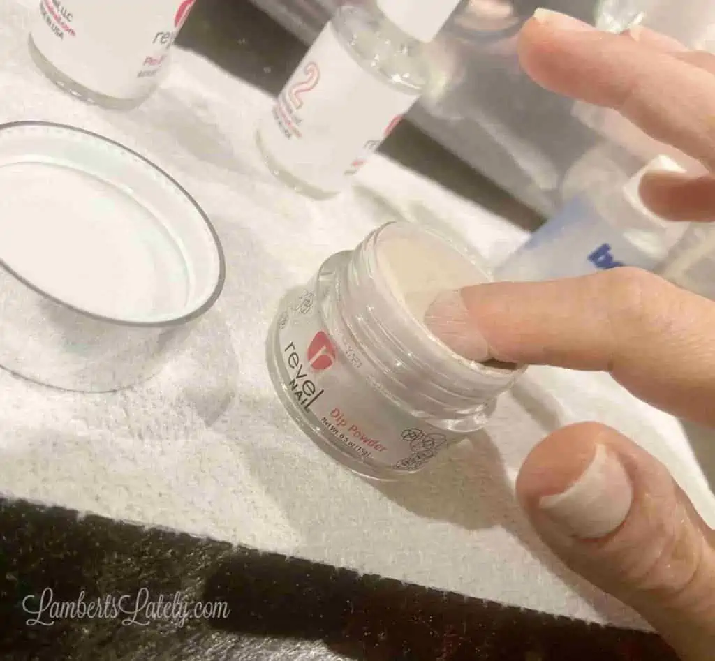 dipping a finger in revel nail's shady