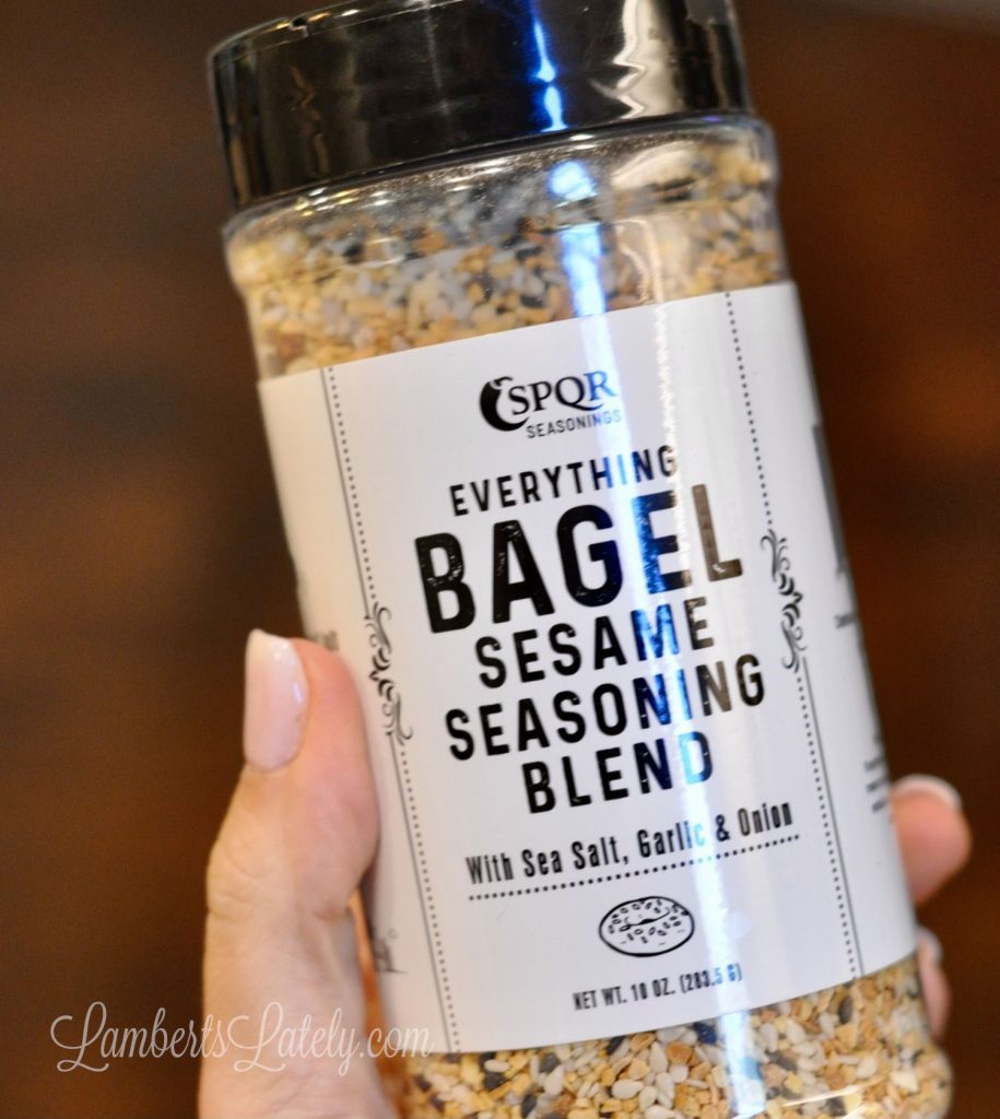 holding a jar of everything bagel seasoning.