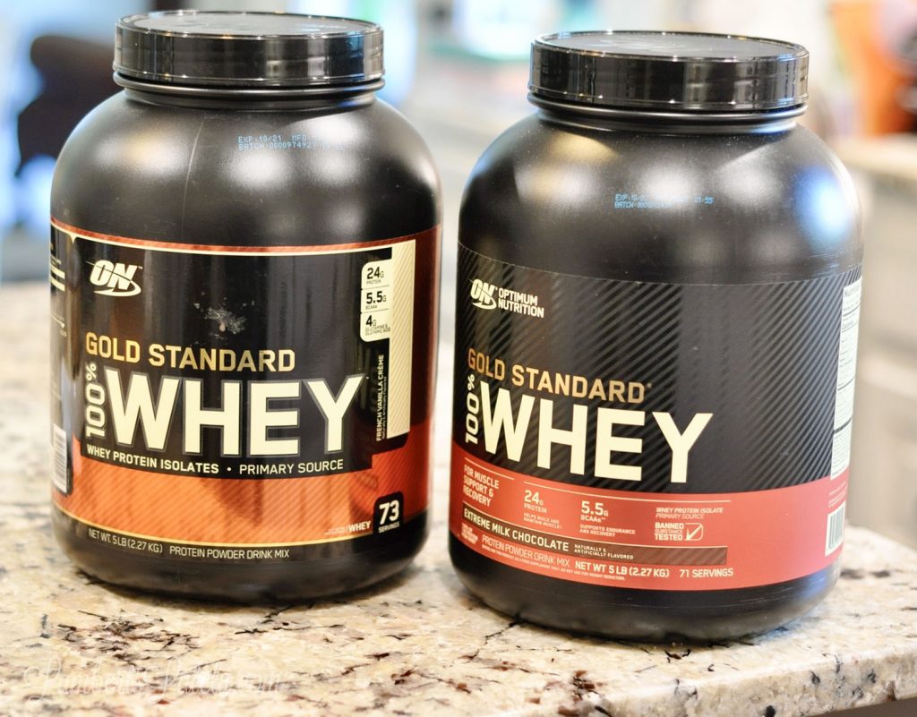 large tubs of whey protein powder.