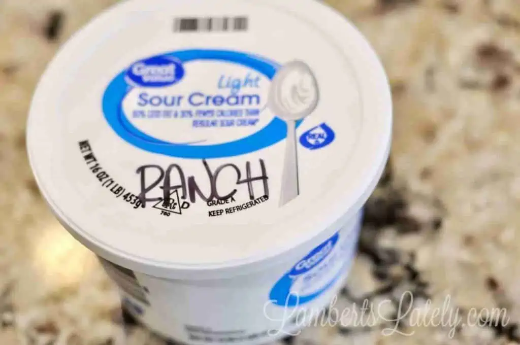 tub of sour cream mixed with mayonnaise and ranch seasoning.