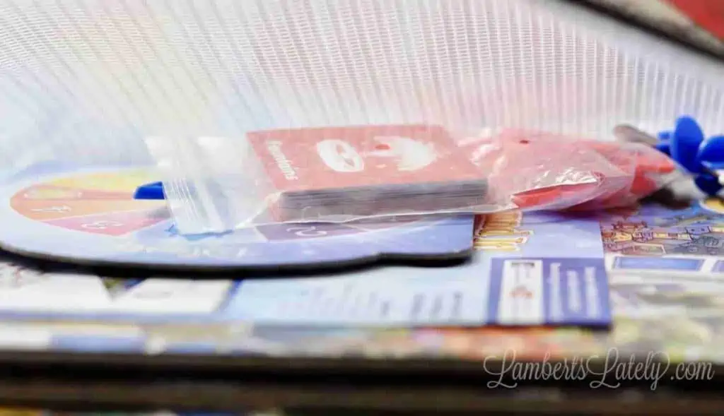 game pieces in a plastic filing bag