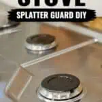 Close-up of a gas stove with a DIY splash guard for easy cleaning and protection.