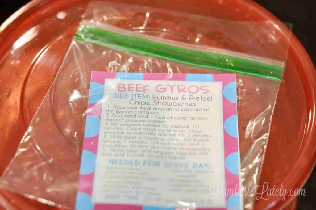 freezer meal label in a plastic bag on top of a freezer container.