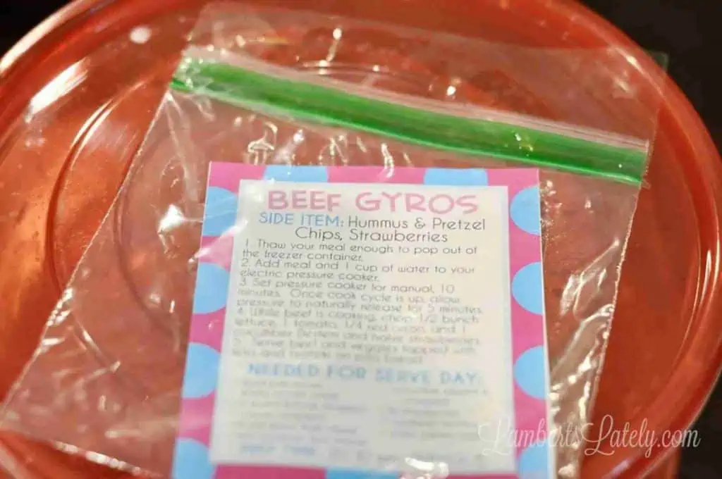 freezer meal label in a plastic bag on top of a freezer container.