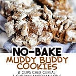 Close-up of muddy buddy cookies with powdered sugar on top.