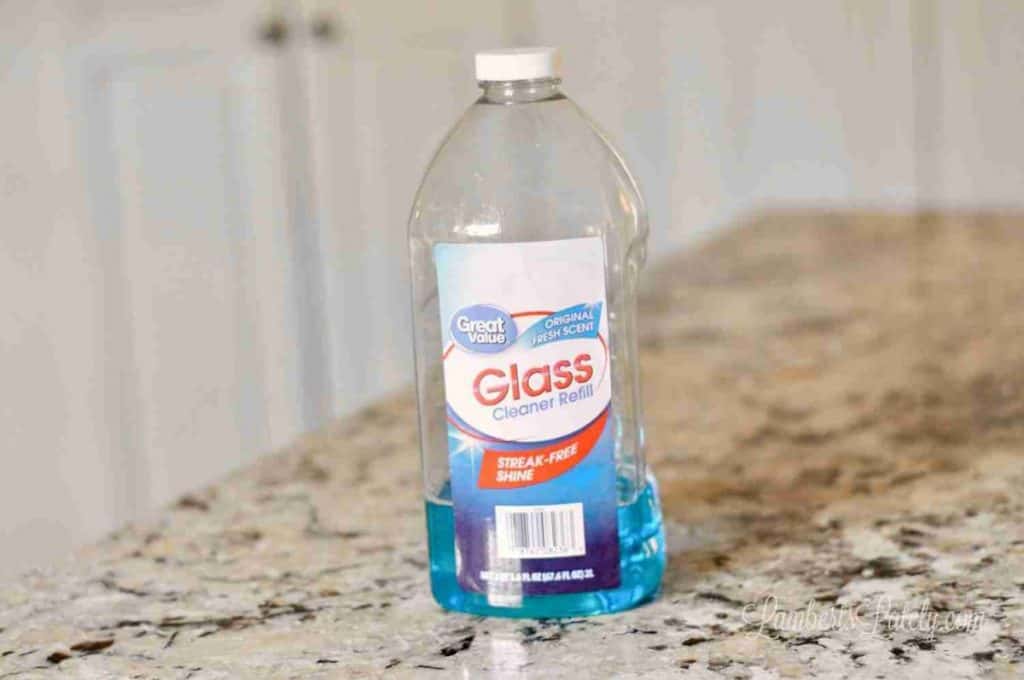 bottle of glass cleaner on a counter.